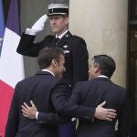 Britain's Prime Minister Rishi Sunak, right, and French President Emmanuel Macron walk during their meeting at the Elysee Palace in Paris
