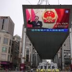 A large video screen shows an image of Chinese President Xi Jinping taking his oath after he is unanimously elected as President during the China's National People's Congress (NPC) head, in Beijing, Saturday, March 11, 2023. China on Saturday named Li Qiang, a close confidant of top leader Xi Jinping, as the country's next premier nominally in charge of the world's second-largest economy now facing some of its worst prospects in years.