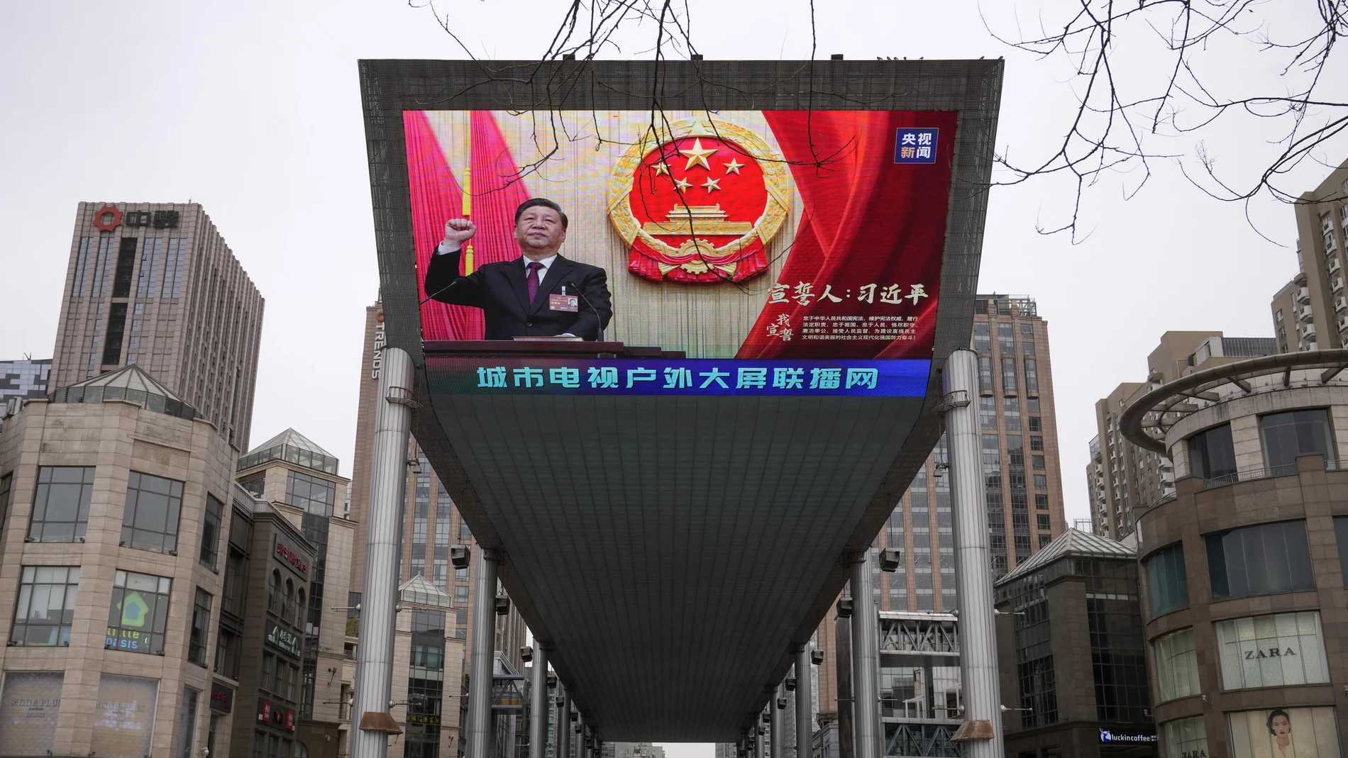 A large video screen shows an image of Chinese President Xi Jinping taking his oath after he is unanimously elected as President during the China's National People's Congress (NPC) head, in Beijing, Saturday, March 11, 2023. China on Saturday named Li Qiang, a close confidant of top leader Xi Jinping, as the country's next premier nominally in charge of the world's second-largest economy now facing some of its worst prospects in years.