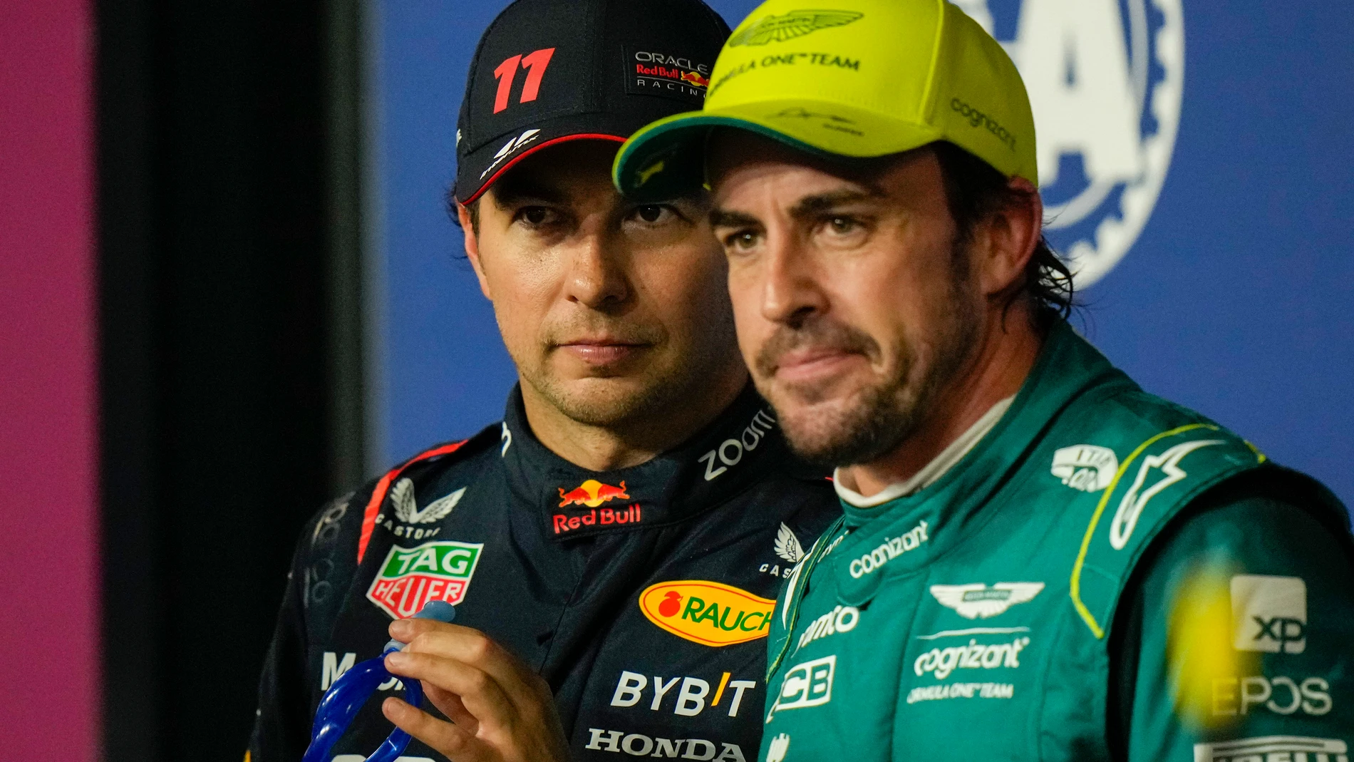 Red Bull driver Sergio Perez of Mexico, left, looks on with Aston Martin driver Fernando Alonso of Spain after the qualifying session ahead of the Formula One Grand Prix at the Jeddah corniche circuit in Jeddah, Saudi Arabia, Saturday, March 18, 2023. Sergio Perez stepped up for Red Bull to ensure the team started from the pole at the Saudi Arabian Grand Prix after a mechanical issue sidelined two-time defending world champion Max Verstappen. (AP Photo/Luca Bruno)