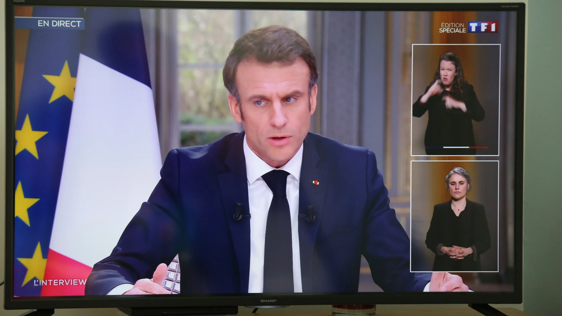 French President Emmanuel Macron is pictured on national television in Saint-Pee sur Nivelle, south-western France, Wednesday, March 22, 2023. French President Emmanuel Macron appeared on national television on Wednesday for the first time since his government forced through the bill age amid mass protests. (AP Photo/Bob Edme)
