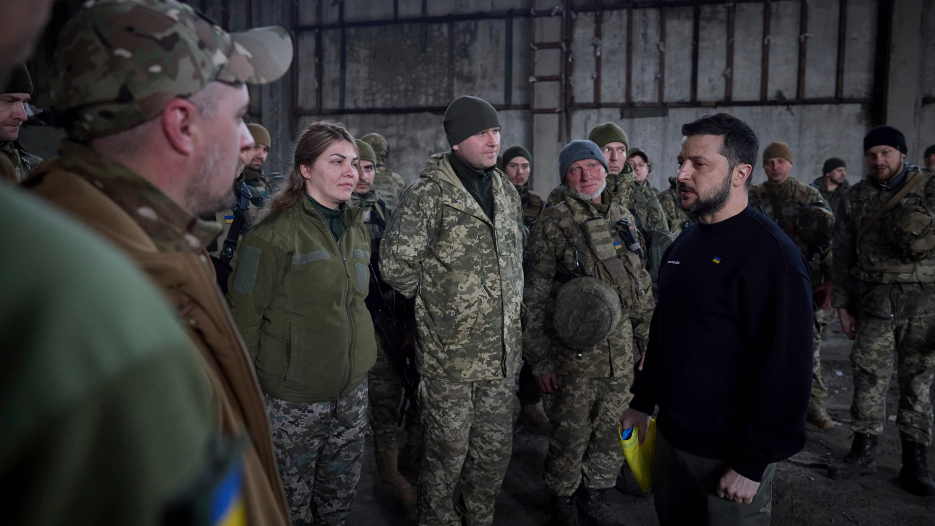 March 22, 2023, Bakhmut, Donetsk Oblast, Ukraine: Ukrainian President Volodymyr Zelenskyy, right, chats with soldiers during a visit to the frontlines positions in the Donetsk region, March 22, 2023 in Bakhmut, Ukraine. Zelenskyy boosted morale and presented state medals to the soldiers defending against the Russian invasion. 22/03/2023