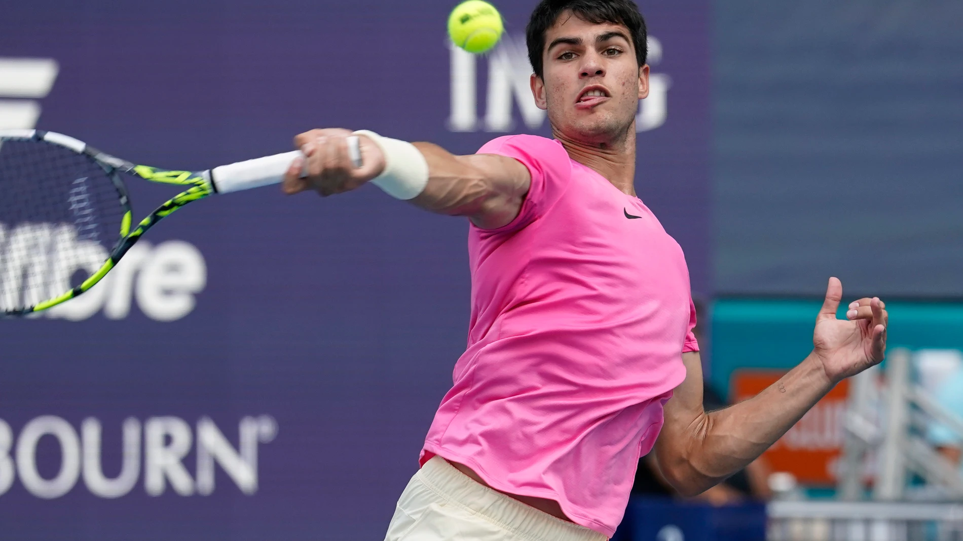 Carlos Alcaraz of Spain returns to Dusan Lajovic of Serbia during the Miami Open tennis tournament, Sunday, March 26, 2023, in Miami Gardens, Fla. (AP Photo/Marta Lavandier)