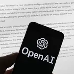 The OpenAI logo is seen on a mobile phone in front of a computer screen displaying output from ChatGPT, Tuesday, March 21, 2023, in Boston. Are tech companies moving too fast in rolling out powerful artificial intelligence technology that could one day outsmart humans? That is the conclusion of a group of prominent computer scientists and other tech industry notables who are calling for a 6-month pause to consider the risks. Their petition published Wednesday, March 29, 2023, is a response to San Francisco startup OpenAI&#39;s recent release of GPT-4.