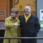 Scottish First Minister Nicola Sturgeon poses for the media with husband Peter Murrell, outside polling station in Glasgow, Scotland. British media are reporting that the husband of former Scottish National Party leader Nicola Sturgeon has been arrested in a party finance probe on Wednesday, April 5, 2023.