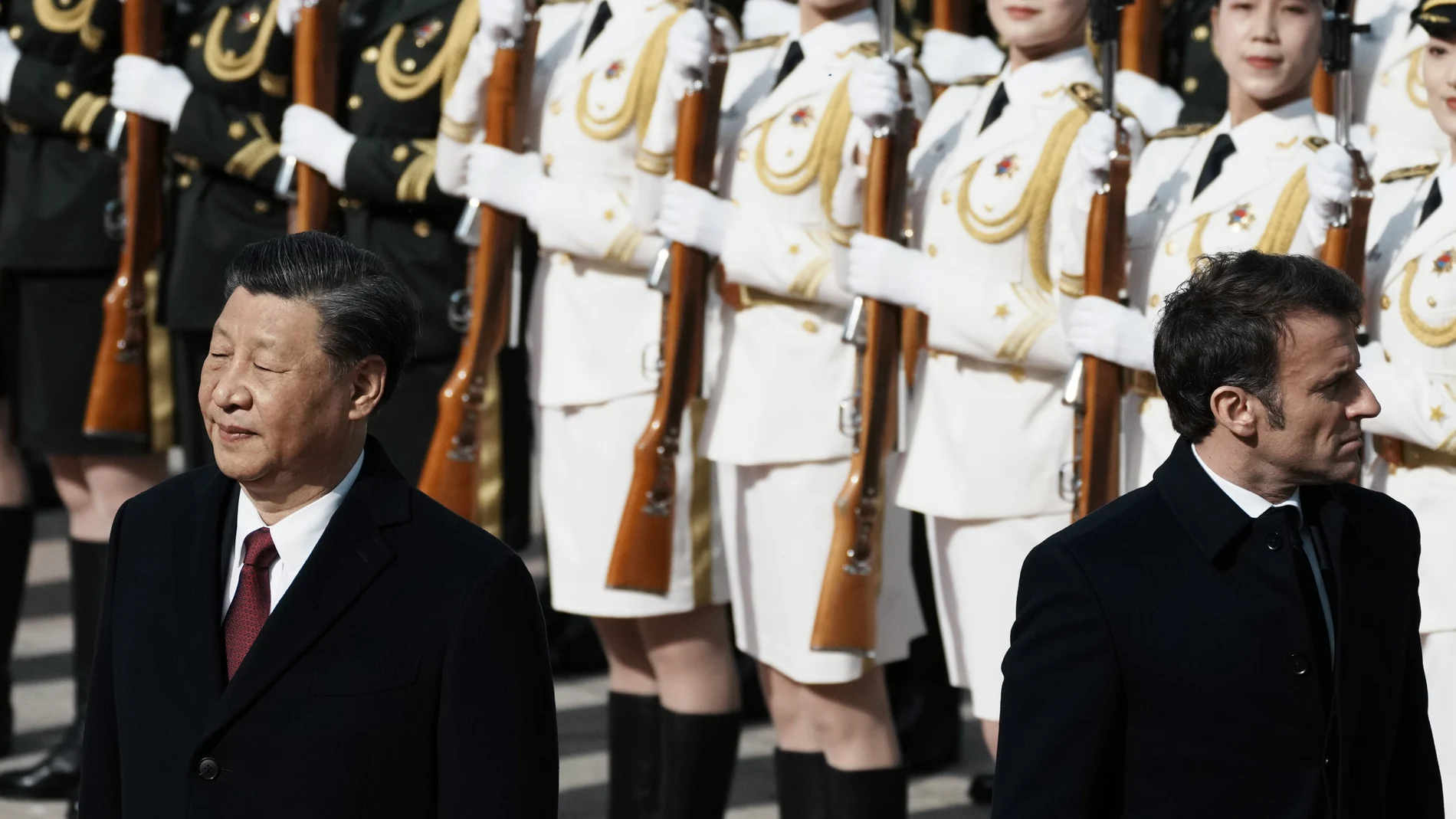 Chinese President Xi Jinping, left, and France's President Emmanuel Macron review troops during a welcome ceremony at the Great Hall of the People in Beijing, China, Thursday, April 6, 2023. 