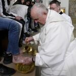 A handout picture provided by the Vatican Media shows Pope Francis performing the rite of the washing of the feet on Holy Thursday in Rome, Italy, 06 April 2023. He washes and kisses the feet of young prisoners that symbolize the apostles.
