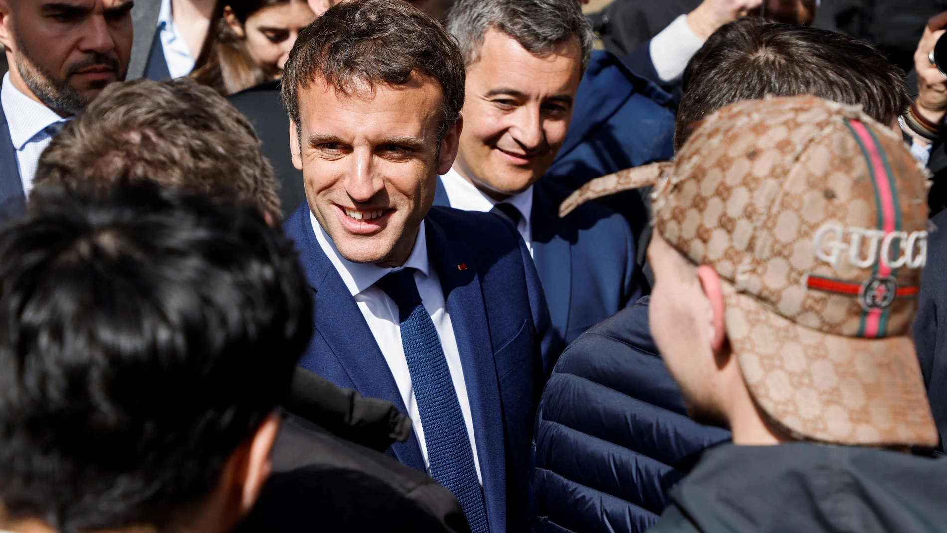 French President, Emmanuel Macron, and Gerald Darmanin (C-R), Interior Minister of France, meet supporters during a visit to the town hall in Denain.