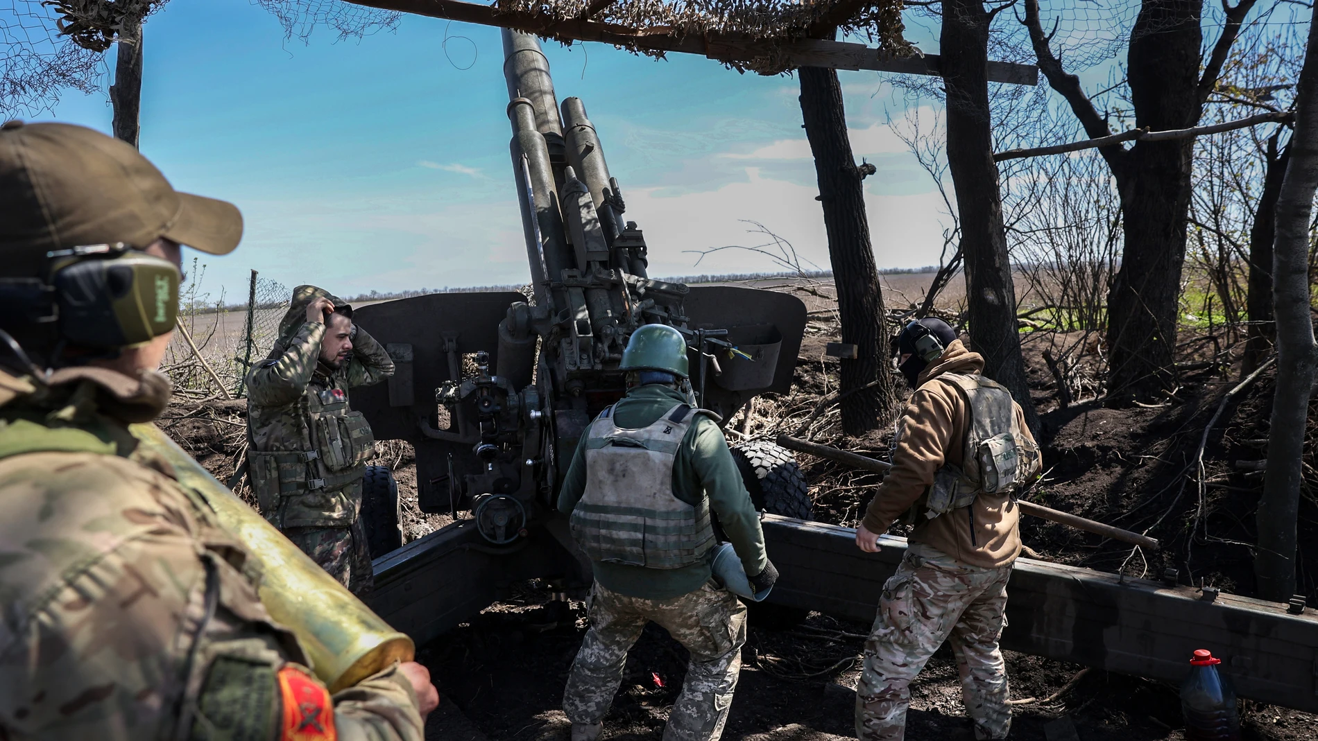 Ukrainian artillerymen prepare a BM-21 Grad multiple rocket launcher to fire towards Russian positions on the frontline, in Donetsk region on April 17, 2023.