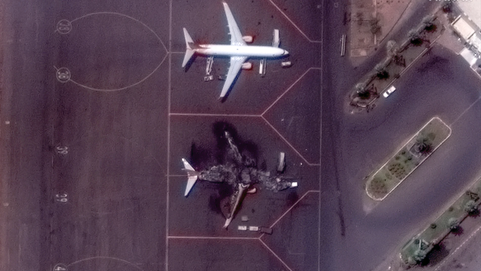 This satellite image provided by Maxar Technologies shows a destroyed Ukrainian airplane in Khartoum International Airport, Sudan, Monday April 17, 2023. The Sudanese military and a powerful paramilitary group are battling for control of the chaos-stricken nation for a third day. (Satellite image ©2023 Maxar Technologies via AP)