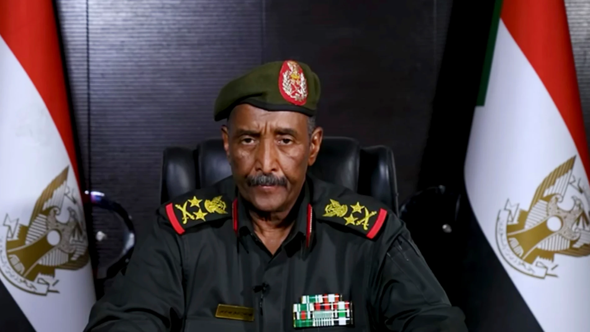 In this image made from video provided Friday, April 21, 2023, by the Sudan Armed Forces, Gen. Abdel-Fattah Burhan, commander of the Sudanese Armed Forces, speaks at an undisclosed location. Sudan's top general said Friday the military is committed to a transition to civilian rule, in his first speech since brutal fighting between his forces and the country's powerful paramilitary began nearly a week ago. (Sudan Armed Forces via AP)