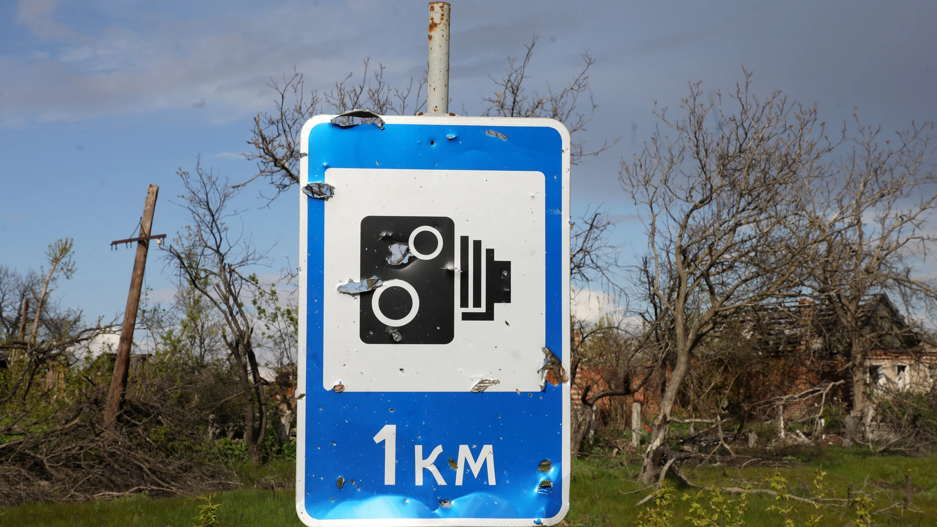 April 23, 2023, Dolyna, Donetsk Region, Ukraine: Shrapnel holes from the shelling of Russian troops dot a road sign in Dolyna, Donetsk Region, eastern Ukraine. 23/04/2023