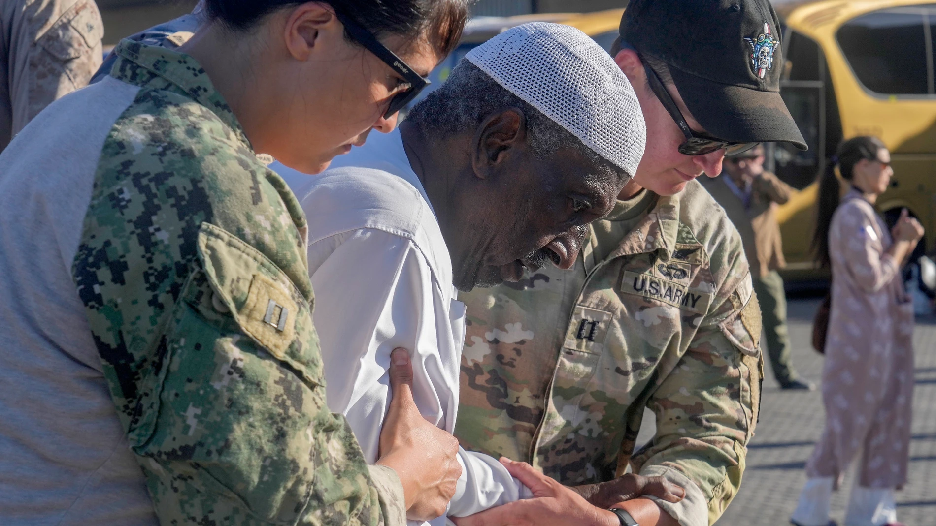 Sudanese evacuee, Mohammed Abdel Rahman, 78, is helped by US naval doctors as he disembarks from the USNS Brunswick at Jeddah port, Saudi Arabia, Thursday, May 4, 2023. The Sudan fighting, which broke out after months of escalating tension between the country’s military and a rival paramilitary group, has so far killed 550 people and displaced hundreds of thousands. (AP Photo/Amr Nabil)