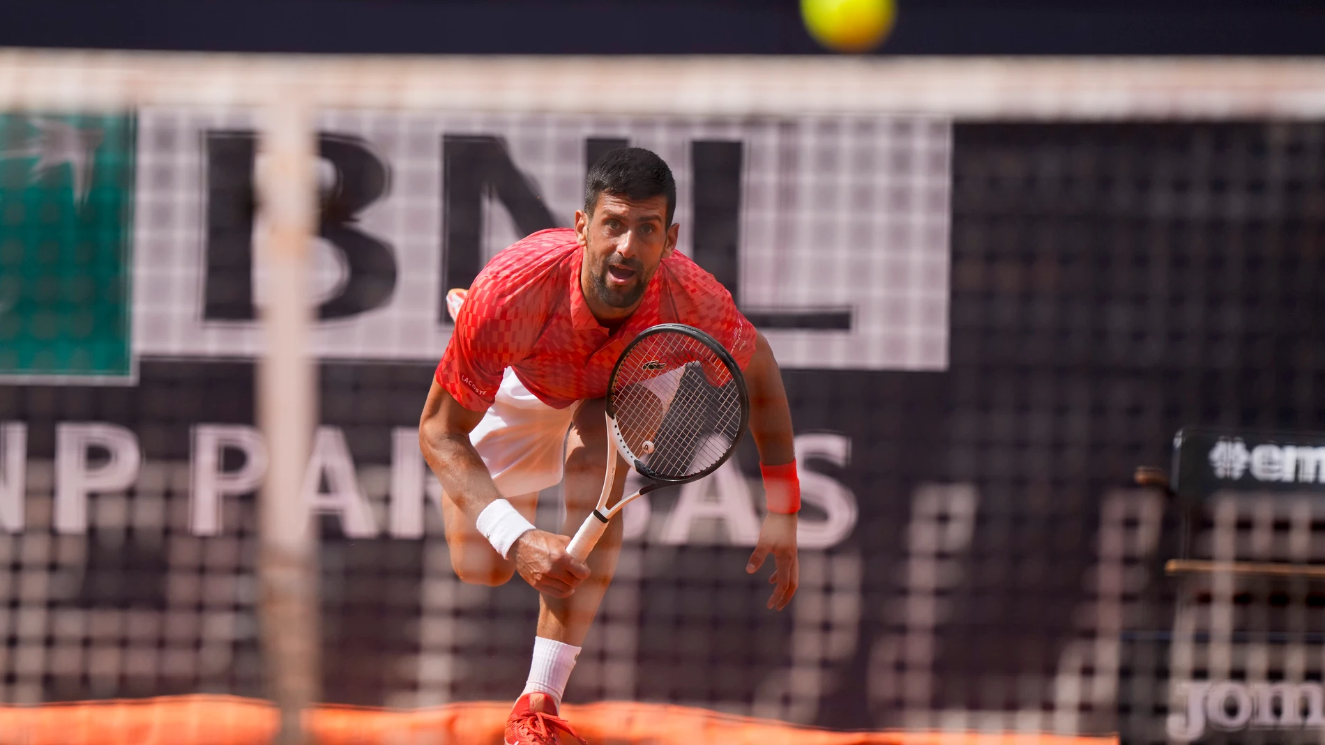 Novak Djocovic returns the ball to Grigor Dimitrov at the Italian Open tennis tournament, in Rome, Sunday, May 14, 2023. (AP Photo/Andrew Medichini)