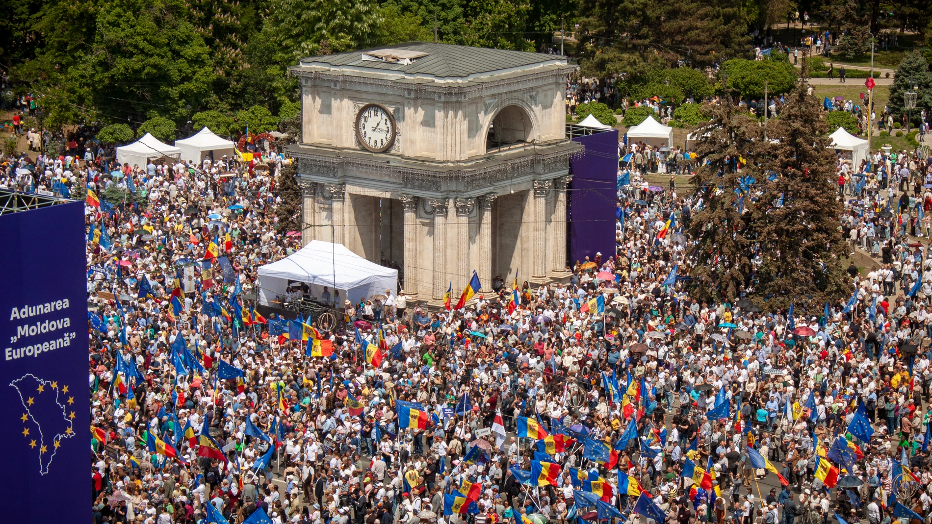 People holding European Union and Moldovan flags fill the Great National Assembly Square in Chisinau, Moldova, Sunday, May 21, 2023, at the end of a rally called by President Maia Sandu, aiming to show the country's support for European Union accession. (AP Photo/Aurel Obreja)