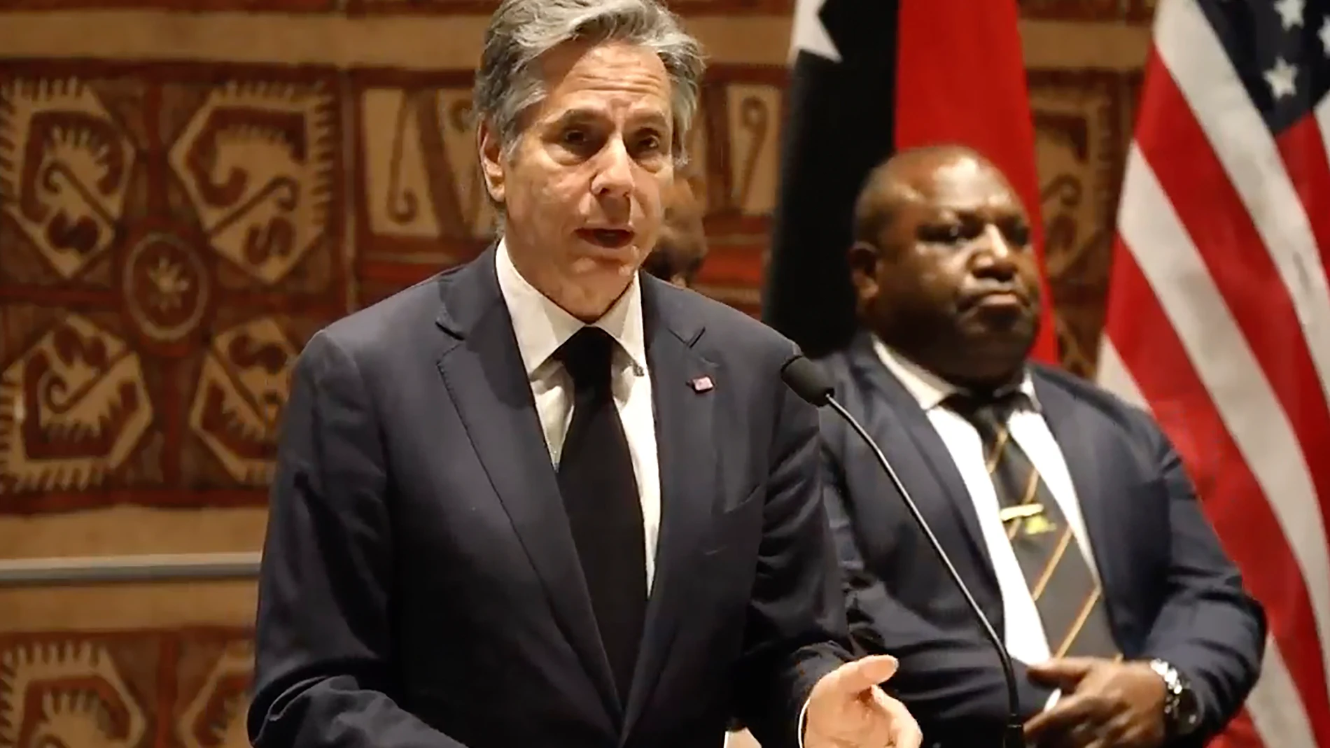 In this image made from video, U.S. Secretary of State Antony Blinken, left, delivers his speech in Port Moresby, Papua New Guinea Monday, May 22, 2023. The United States signed a new security pact with Papua New Guinea on Monday as it competes with China for influence in the Pacific. The United States signed a new security pact with Papua New Guinea on Monday as it competes with China for influence in the Pacific. (Australian Broadcasting Corp. via AP)