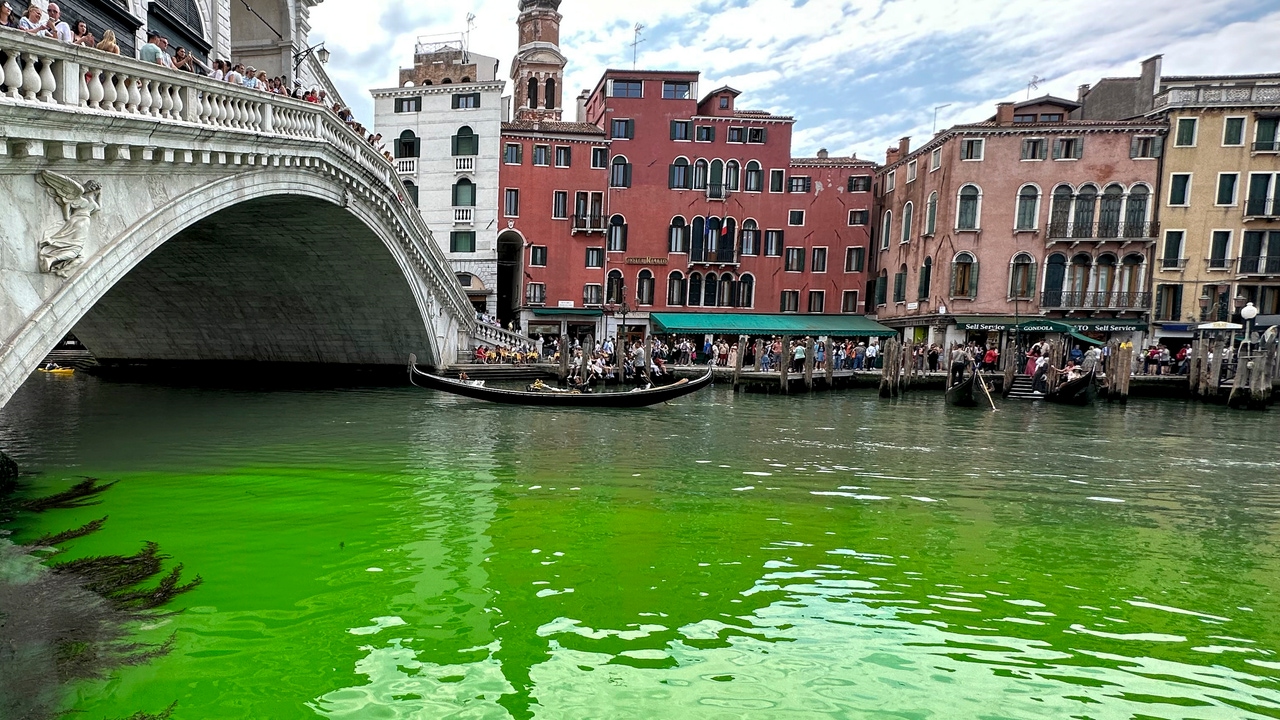 The canals of Venice dawn dyed green
