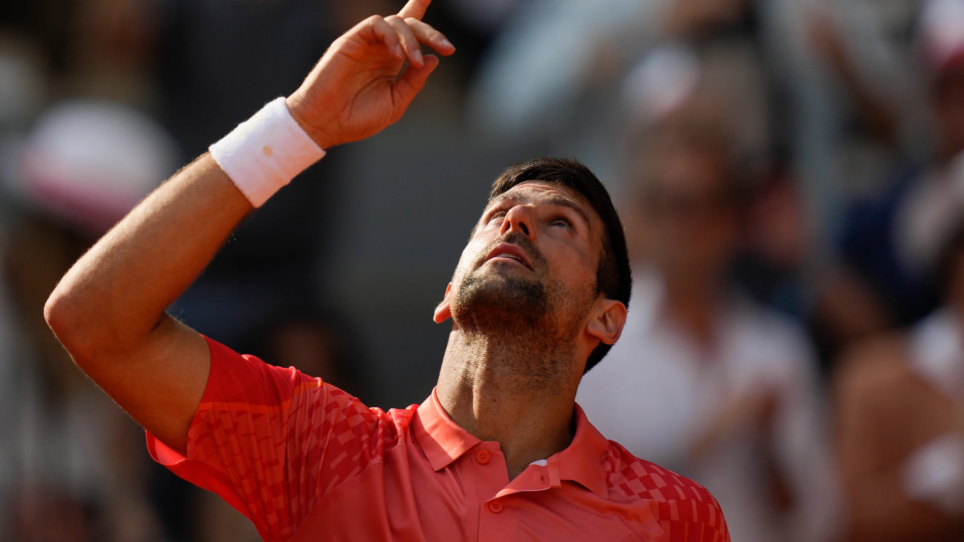 Serbia's Novak Djokovic celebrates winning his semifinal match of the French Open tennis tournament against Spain's Carlos Alcaraz in four sets, 6-3, 5-7, 6-1, 6-1, at the Roland Garros stadium in Paris, Friday, June 9, 2023. (AP Photo/Thibault Camus)