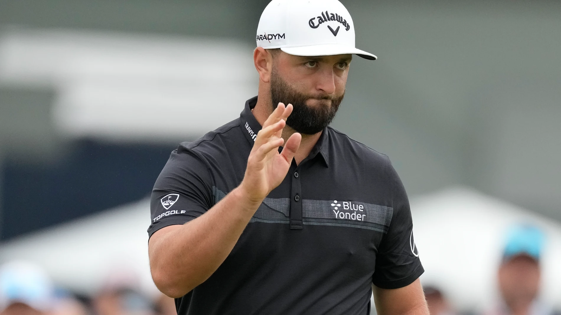 Jon Rahm waves after his putt on the 10th hole during the first round of the U.S. Open golf tournament at Los Angeles Country Club on Thursday, June 15, 2023, in Los Angeles. (AP Photo/Marcio J. Sanchez)