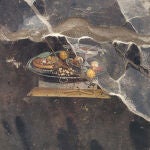 Descubren la representación de un posible antepasado de la pizza en un fresco en Pompeya