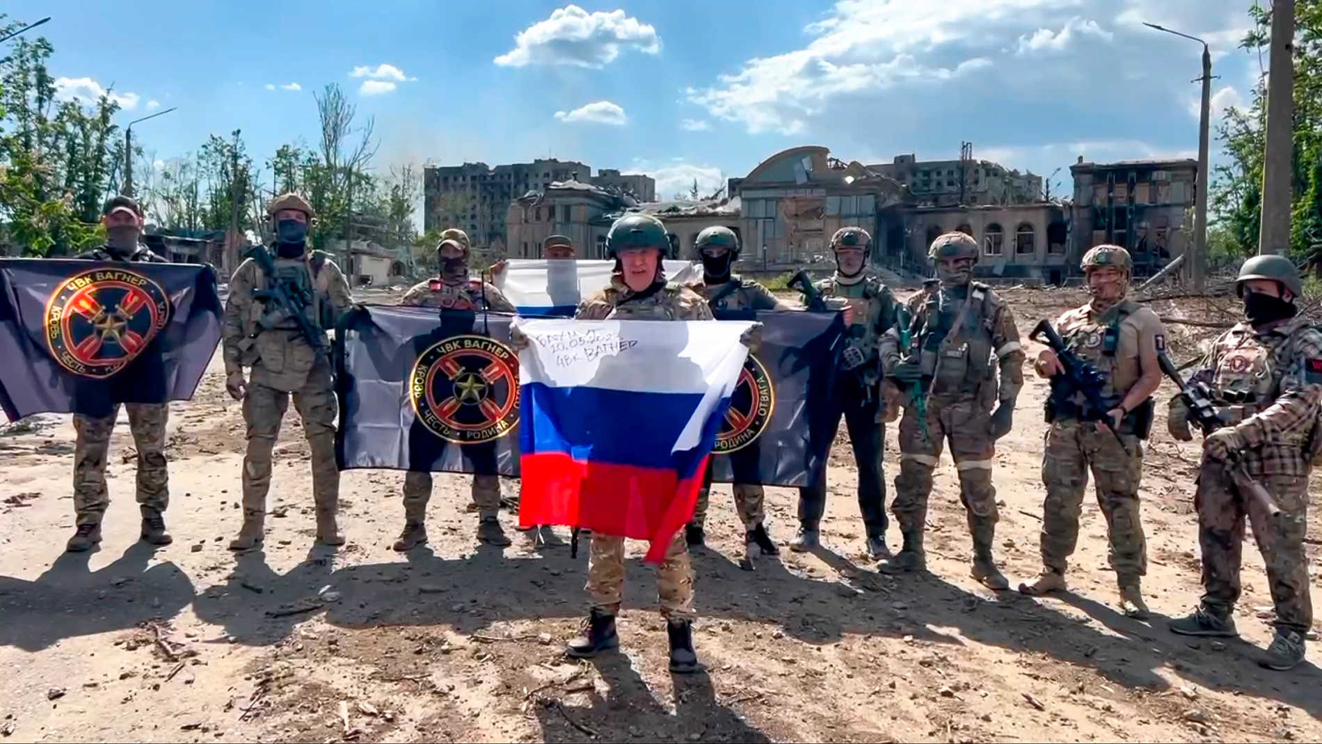FILE - A framegrab taken from video and released by Prigozhin Press Service Saturday, May 20, 2023 shows Yevgeny Prigozhin, the owner of the Wagner Group military company, holding a Russian flag in Bakhmut, Ukraine. Following an armed rebellion by a mercenary group in Russia, tensions are rising in and around neighboring Belarus, where the exiled leader of the force and some of its fighters are settling in. While authoritarian President Alexander Lukashenko has offered them refuge, that isn't...