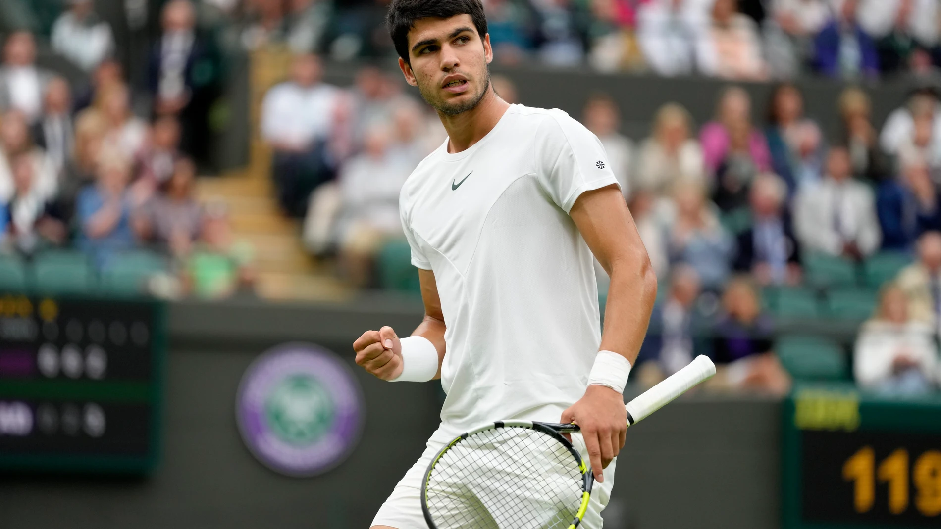 Spain's Carlos Alcaraz celebrates after winning a point against Jeremy Chardy of France in a first round men's singles match on day two of the Wimbledon tennis championships in London, Tuesday, July 4, 2023. (AP Photo/Kirsty Wigglesworth)