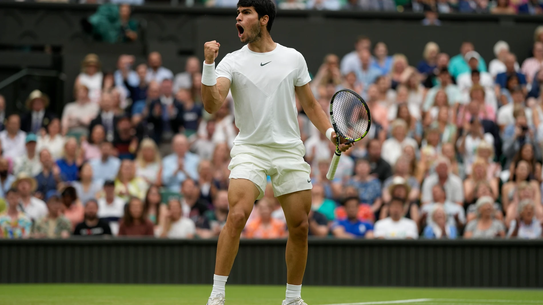 Spain's Carlos Alcaraz reacts after winning a point against Chile's Nicolas Jarry in a men's singles match on day six of the Wimbledon tennis championships in London, Saturday, July 8, 2023. (AP Photo/Alastair Grant)