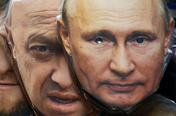 ace masks depicting Russian President Vladimir Putin, right, and owner of private military company Wagner Group Yevgeny Prigozhin are displayed among others for sale at a souvenir shop in St. Petersburg, Russia.