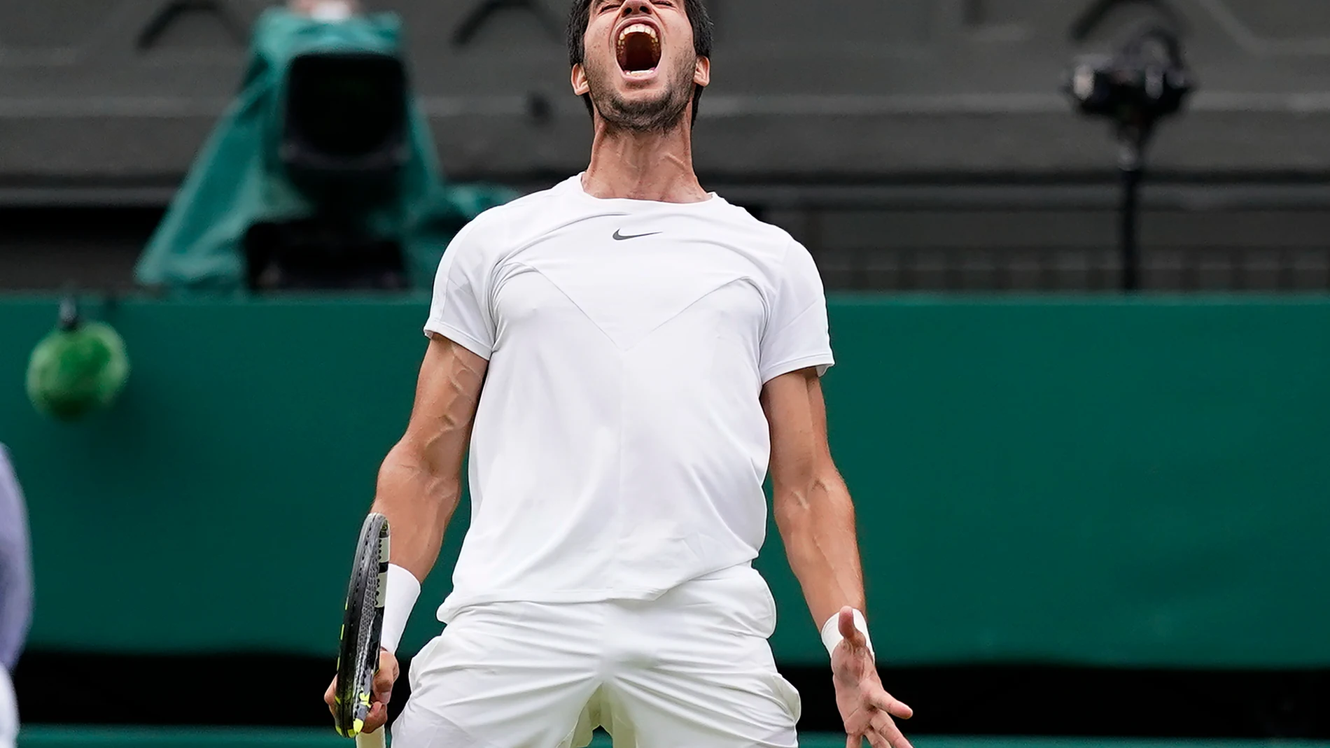 Spain's Carlos Alcaraz celebrates as he wins a point against Italy's Matteo Berrettini in a men's singles match on day eight of the Wimbledon tennis championships in London, Monday, July 10, 2023. (AP Photo/Alberto Pezzali)