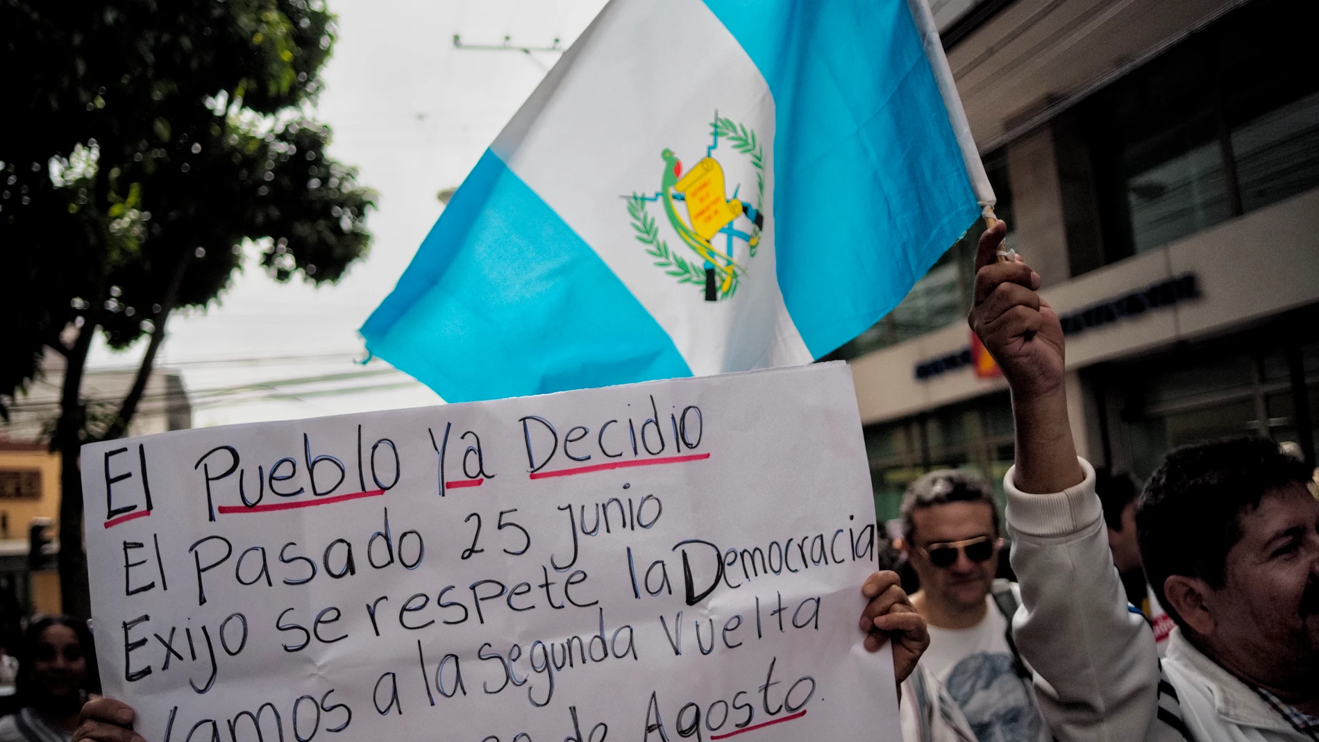 July 8, 2023, Guatemala City, Guatemala, Guatemala: Central America - Guatemala, capital city Guatemala City: The sign reads "THE PEOPLE HAVE DECIDED LAST JUNE 25, I DEMAND THAT DEMOCRACY TO BE RESPECTED. LET;S DO THE RUNOFF NEXT AUGUST 20"...University students and civilians march to demand the results of the recent presidential elections to be respected and allow the presidential candidate, Bernardo Arevalo, of the Movimiento Semilla party to participate on the runoff against Sandra Torre ...