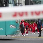 Members of the Philippines Women's World Cup team walk to their team bus following a shooting near their hotel in the central business district in Auckland,New Zealand