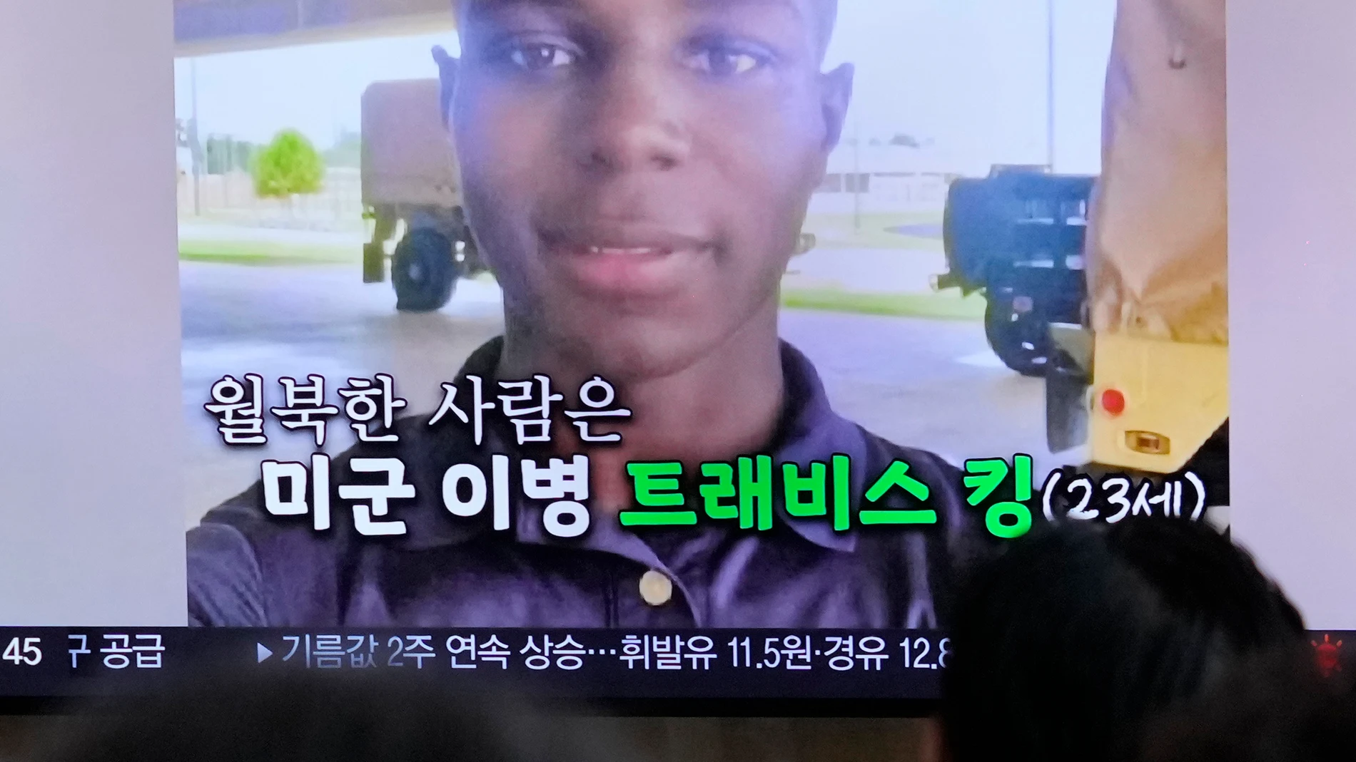 A TV screen shows a file image of American soldier Travis King during a news program at the Seoul Railway Station in Seoul, South Korea, Saturday, July 22, 2023. King bolted into North Korea while on a tour of the Demilitarized Zone on Tuesday, a day after he was supposed to travel to a base in the U.S. The Korean words on the screen reads, "The person who ran to North Korea is U.S. soldier Private Travis King (age 23)." (AP Photo/Ahn Young-joon)