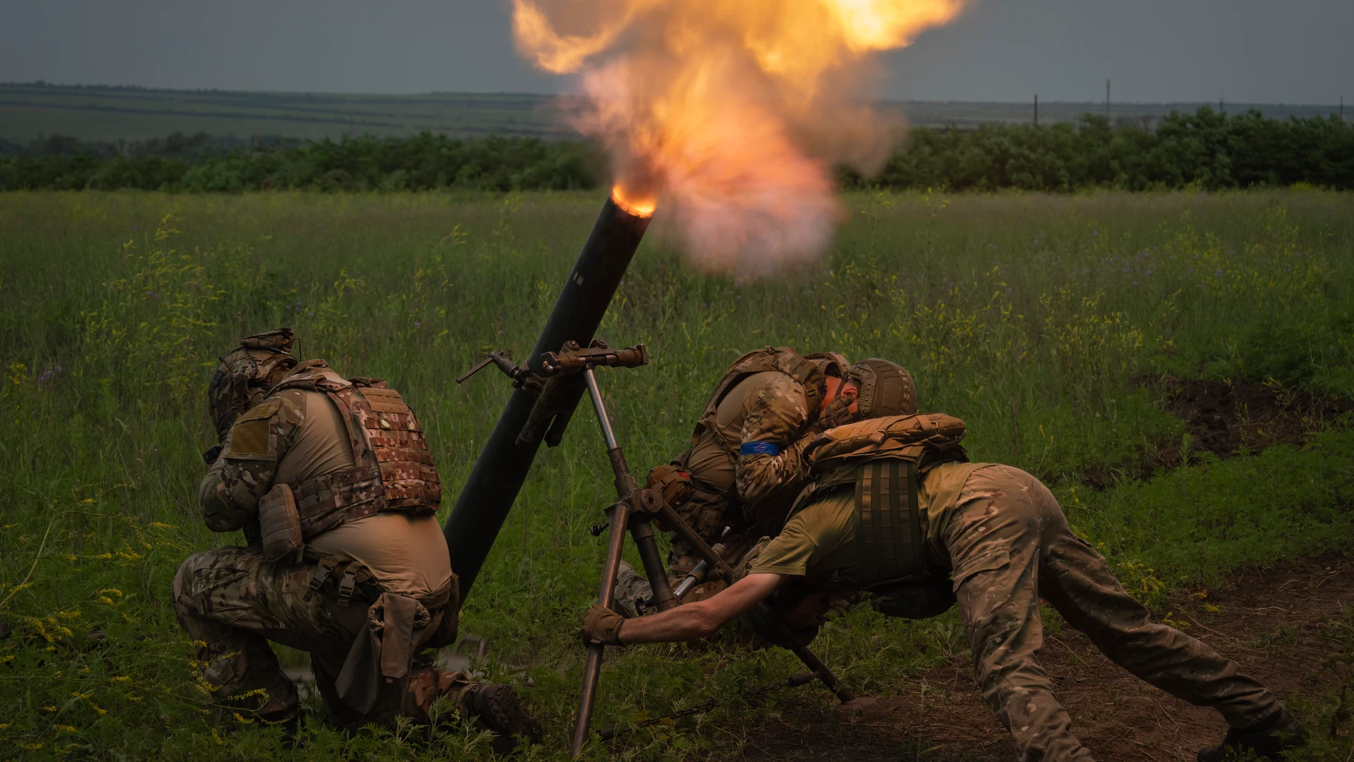FILE - Ukrainian soldiers fire toward Russian position on the frontline in Zaporizhzhia region, Ukraine, Saturday, June 24, 2023. Battles are also raging along the southern front in Zaporizhzhia, where Ukrainian forces are making minimal gains and coming up against formidable Russian fortifications. (AP Photo/Efrem Lukatsky, File)