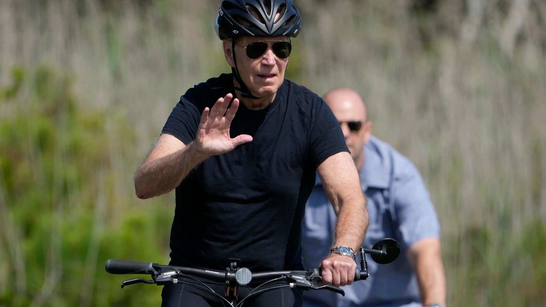 President Joe Biden rides a bike on a path at Gordons Pond in Rehoboth Beach, Del., Wednesday, Aug. 2, 2023. (AP Photo/Manuel Balce Ceneta)