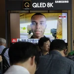 A TV screen shows a file image of American soldier Travis King during a news program at the Seoul Railway Station in Seoul, South Korea, Wednesday, Aug. 16, 2023. North Korea asserted Wednesday that the U.S. soldier who bolted into the North across the heavily armed Korean border last month did so after being disillusioned with the inequality of American society and racial discrimination in its Army. (AP Photo/Ahn Young-joon)