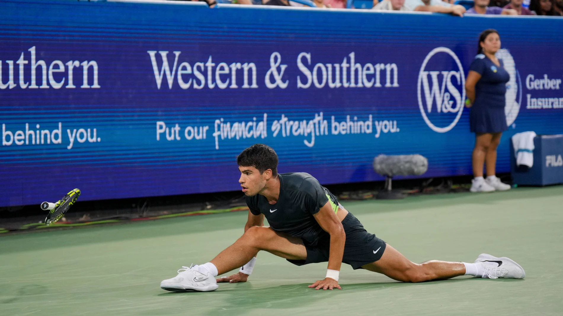 Carlos Alcaraz, of Spain, loses his racquet as he is unable to return a shot to Novak Djokovic, of Serbia, during the men's singles final of the Western & Southern Open tennis tournament, Sunday, Aug. 20, 2023, in Mason, Ohio. (AP Photo/Aaron Doster)
