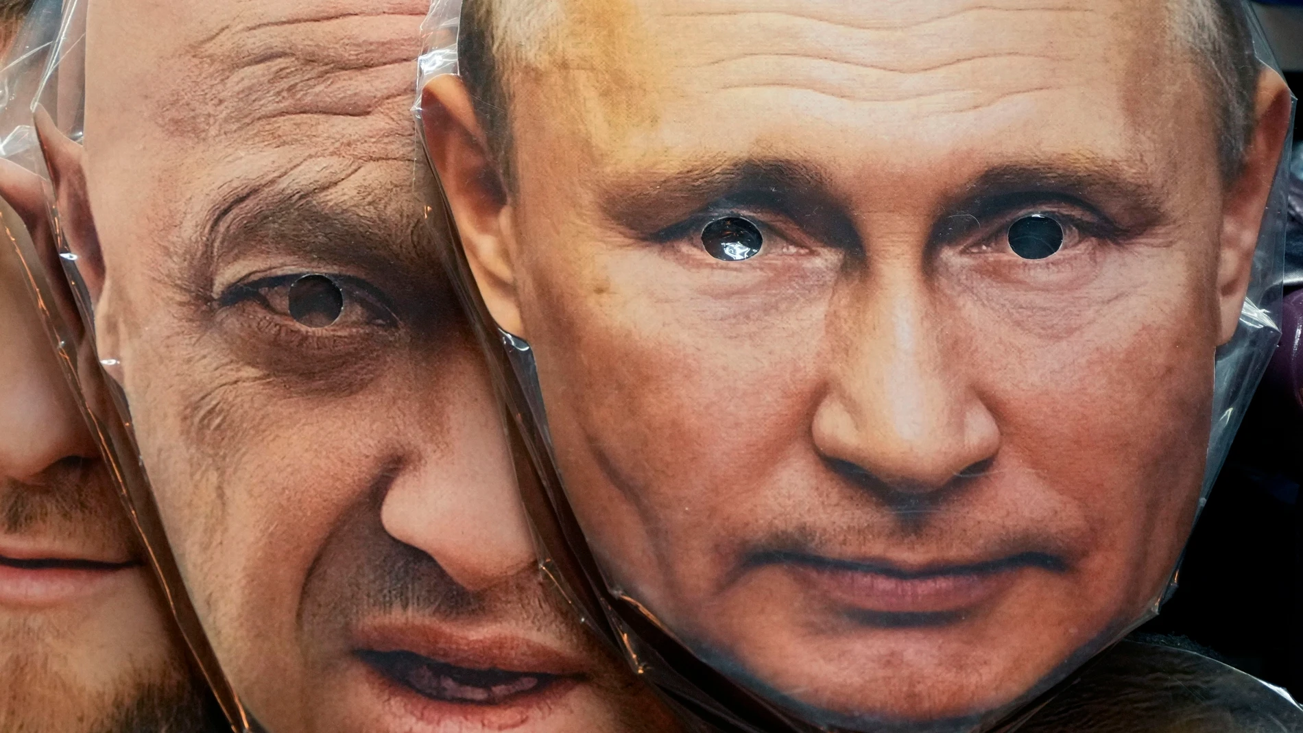 FILE - Face masks depicting Russian President Vladimir Putin, right, and owner of private military company Wagner Group Yevgeny Prigozhin are displayed among others for sale at a souvenir shop in St. Petersburg, Russia, on June 4, 2023. Prigozhin was aboard a plane that crashed north of Moscow on Wednesday, Aug. 23, 2023 killing all 10 people on board. On Sunday, Russia's Investigative Committee said forensic and genetic testing identified all 10 bodies recovered from the crash, and the ident...
