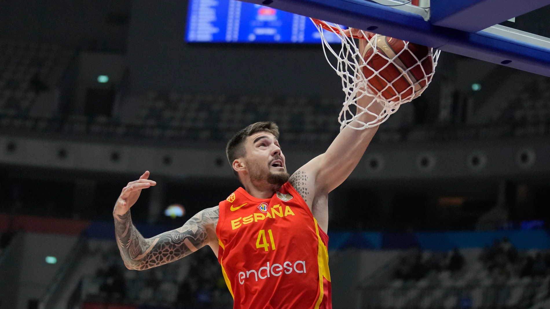 Spain forward Juancho Hernangomez (41) dunks to score against Iran during the Basketball World Cup group G match between Spain and Iran at the Indonesia Arena stadium in Jakarta, Indonesia, Wednesday, Aug. 30, 2023. (AP Photo/Dita Alangkara)