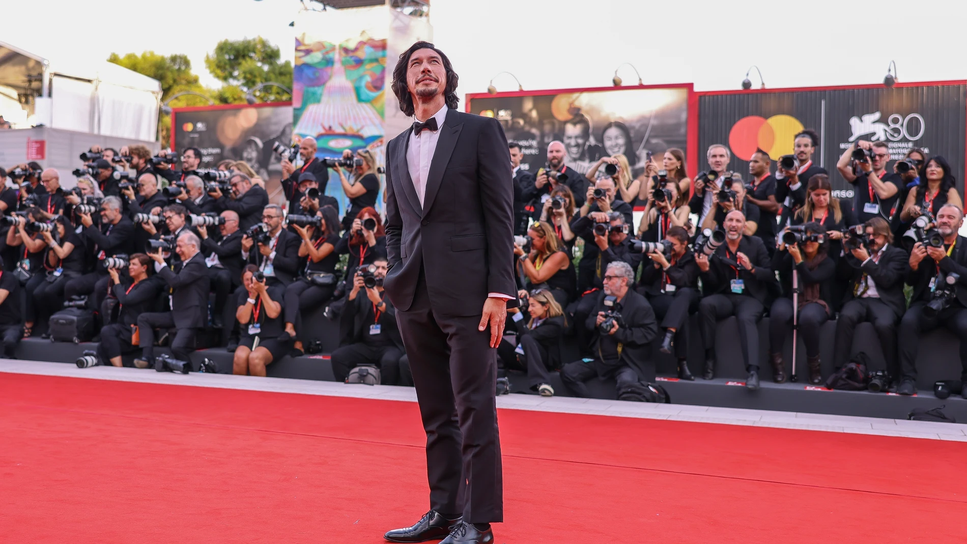 Adam Driver poses for photographers upon arrival for the premiere of the film 'Ferrari' during the 80th edition of the Venice Film Festival in Venice, Italy, on Thursday, Aug. 31, 2023. (Photo by Vianney Le Caer/Invision/AP)