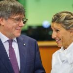 Member of the European Parliament Carles Puigdemont (L) and Spanish Second Deputy Prime Minister and Sumar party leader Yolanda Diaz speak in Brussels.
