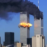 Hijacked United Airlines Flight 175, which departed from Boston en route for Los Angeles, crashes into the South Tower of the World Trade Towers Sept, 11, 2001. The North Tower is shown burning after American Airlines Flight 11 crashed into the tower at 8:45 a.m. 