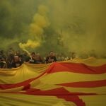 Protesters hold independence flags and flares during the Catalan National Day in Barcelona, Spain, Monday, Sept. 11, 2023. The traditional September 11, called "Diada", marks the fall of the Catalan capital to Spanish forces in 1714. 