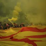 Protesters hold independence flags and flares during the Catalan National Day in Barcelona, Spain, Monday, Sept. 11, 2023. The traditional September 11, called "Diada", marks the fall of the Catalan capital to Spanish forces in 1714. 