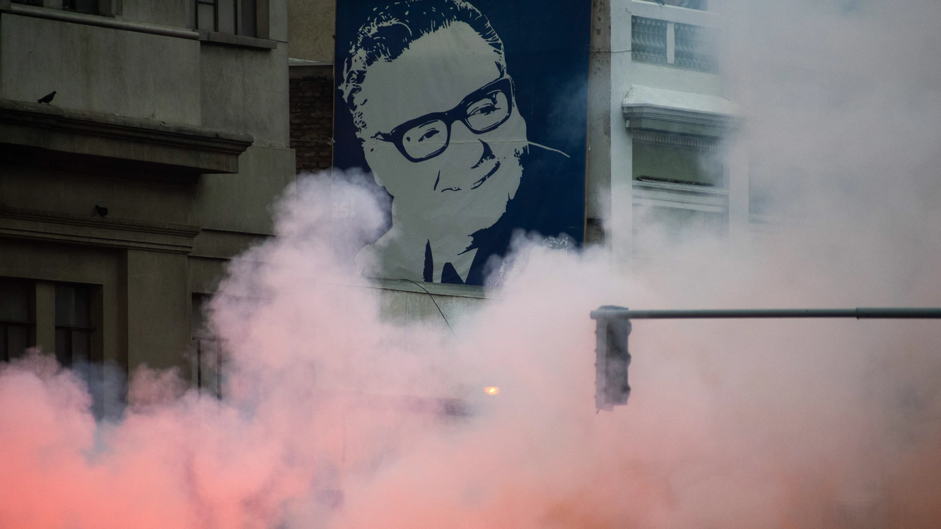 September 10, 2023, Santiago, Metropolitana, Chile: A mural of Savlador Allende is seen amidst the smoke from flares during a march marking the 50th anniversary of the military coup led by Augusto Pinochet that overthrew President Allende, in Santiago, Chile. 10/09/2023