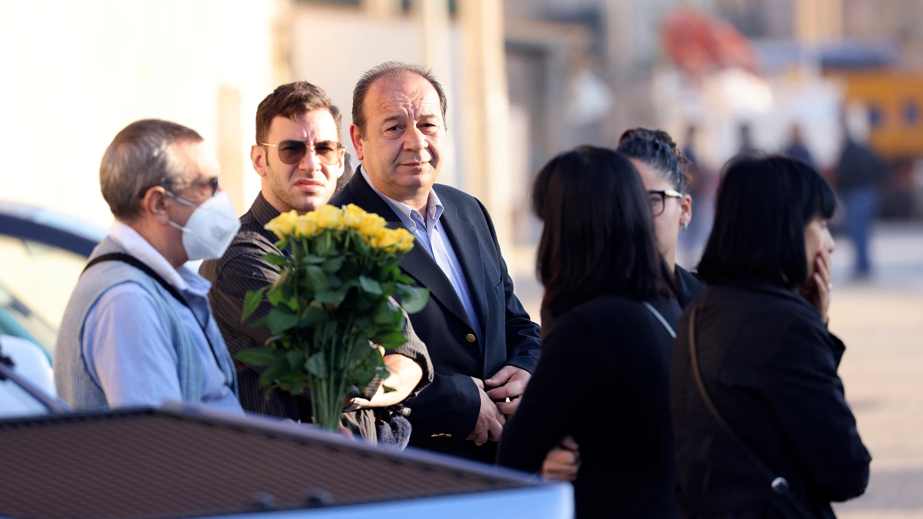 Relatives of late Mafia boss Matteo Messina Denaro, including his brother Salvatore, holding flowers at left, and sister Bice, right, wait for Denaro's funeral hearse to arrive at the cemetery of Castelvetrano, in Sicily, southern Italy, Wednesday, Sept. 27, 2023. Denaro, a convicted mastermind of some of the Sicilian Mafia’s most heinous slayings, died on Monday in a hospital prison ward, several months after being captured as Italy’s No. 1 fugitive and following decades on the run. (Alberto...
