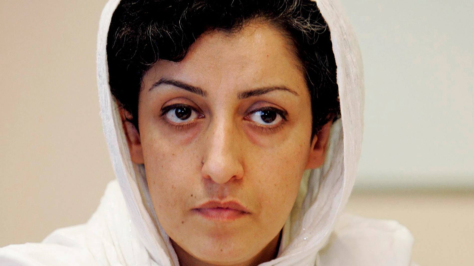 FILE - Iranian Narges Mohammadi, delegate of the Center for Human Rights Defenders, listens to a question during a press conference on the Assessment of the Human Rights Situation in Iran, at the U.N. headquarters in Geneva, Switzerland, on June 9, 2008. The Nobel Peace Prize has been awarded to Narges Mohammadi for fighting oppression of women in Iran. The chair of the Norwegian Nobel Committee announced the prize Friday, Oct. 6, 2023 in Oslo. (Magali Girardin/Keystone via AP, File)