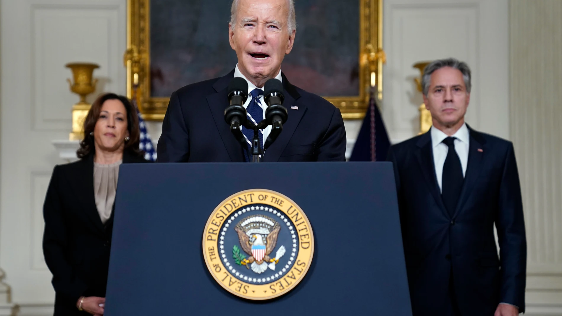 President Joe Biden speaks Tuesday, Oct. 10, 2023, in the State Dining Room of the White House in Washington, about the war between Israel and the militant Palestinian group Hamas, as Vice President Kamala Harris and Secretary of State Antony Blinken listen. (AP Photo/Evan Vucci)