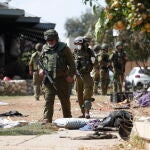 Israeli army remove bodies from Kfar Aza kibbutz