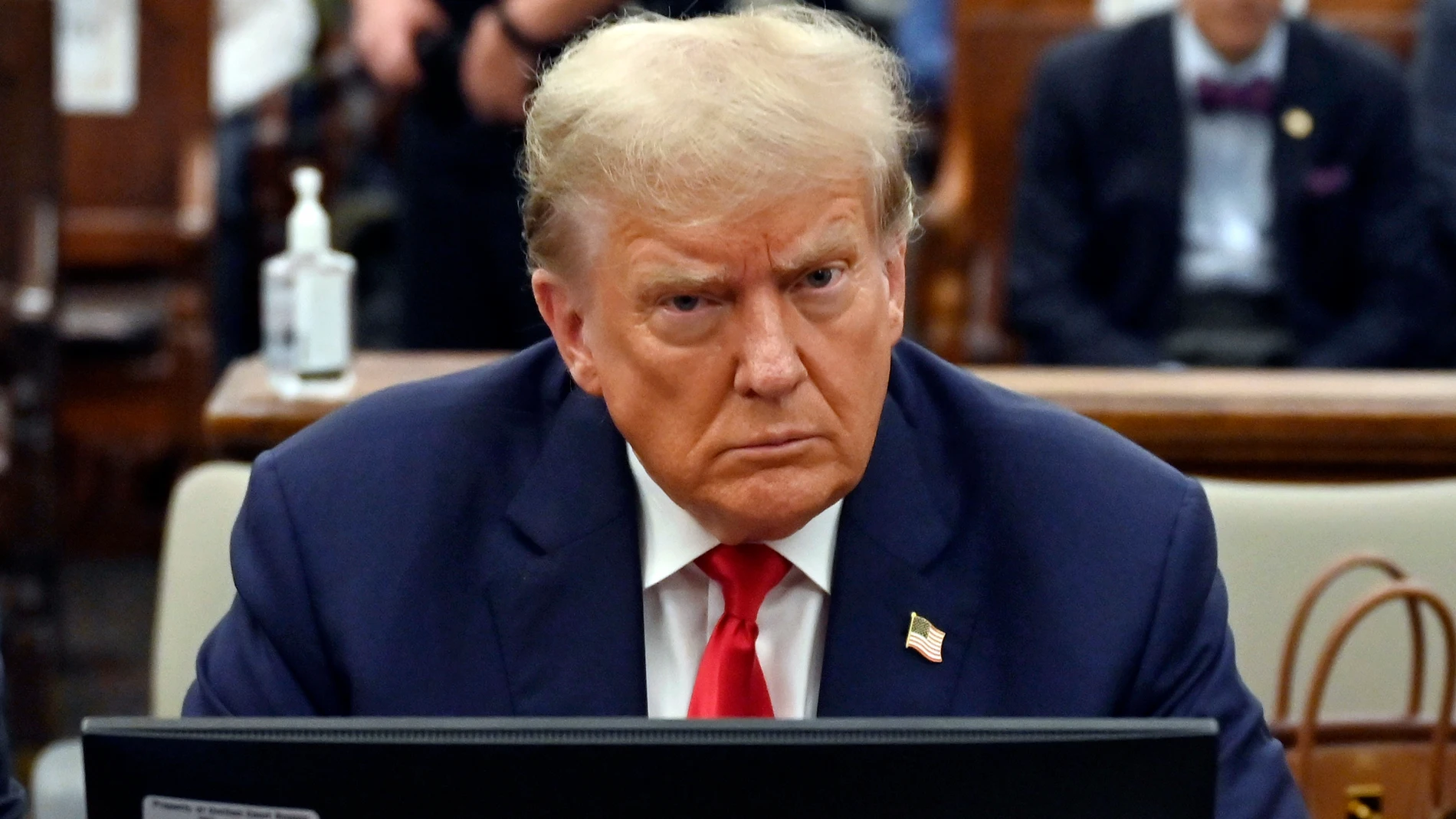 FILE - Former President Donald Trump sits during his civil fraud trial at the State Supreme Court building in New York, Oct. 4, 2023. Trump is set to be questioned under oath as part of lawsuits from two former FBI employees who provoked the former president's outrage after sending each other pejorative text messages about him.(Angela Weiss/Pool via AP)