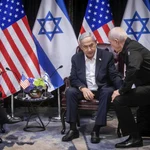 US President Joe Biden (L) looks on during a meeting with Israeli Prime Minister Benjamin Netanyahu (C) who confers with Israeli Defense Minister Yoav Gallant (R) in Tel Aviv, Israel, 18 October 2023. President Biden pledged US support for Israel and said the overnight attack on a hospital in the Gaza strip 'appears' to have been caused 'by the other team'. 